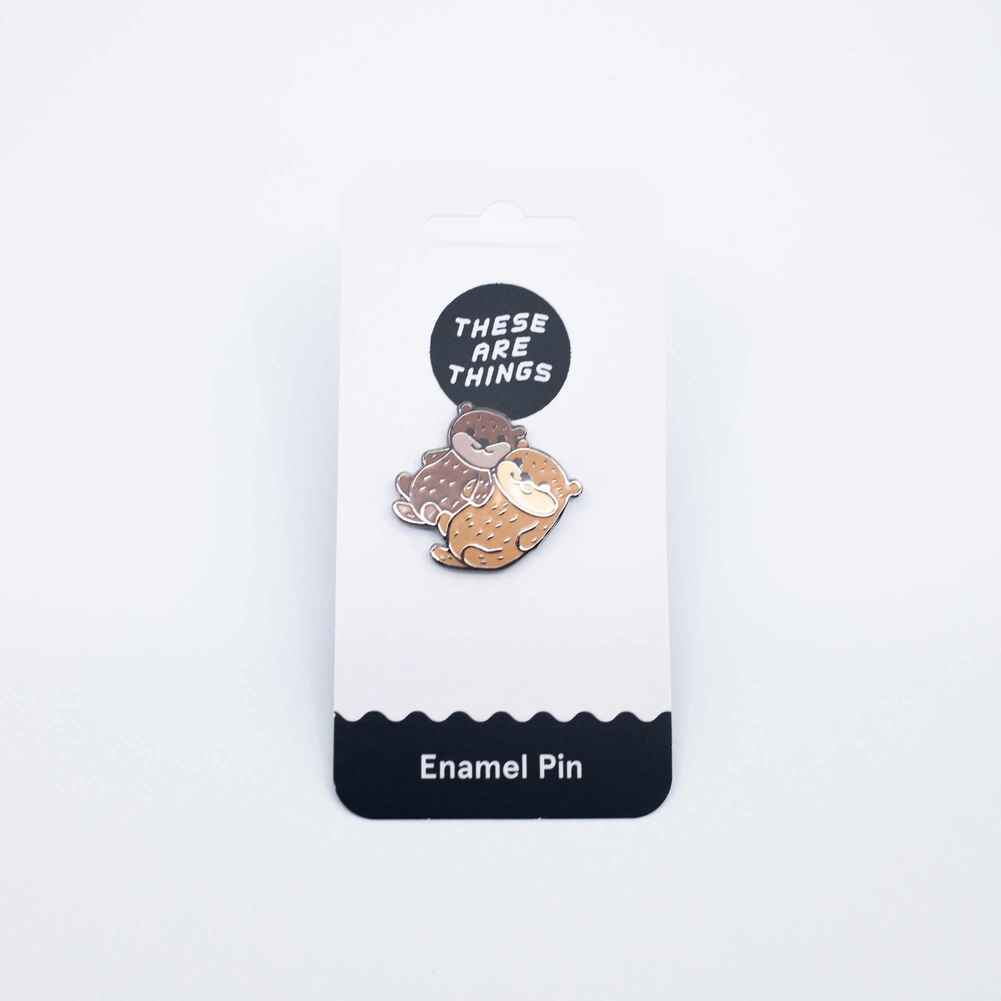 Holding Hands Otters Pin